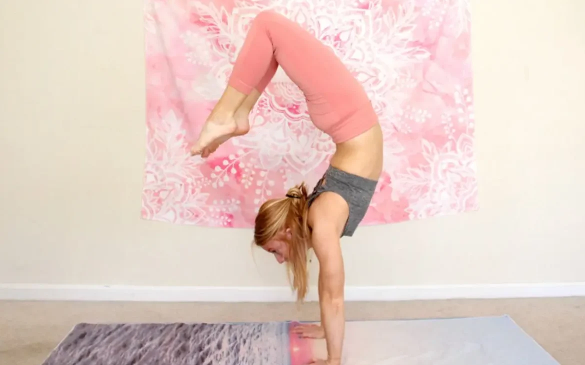 Woman doing a arched handstand with her feet approaching her head