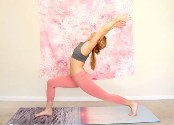 Woman doing a warrior one pose with an open chest, as the cover image for the heart opening yoga sequence blog
